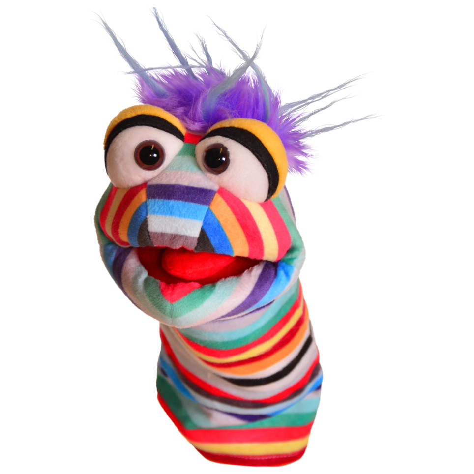Colorful striped hand puppet with purple hair, large expressive eyes, and open mouth