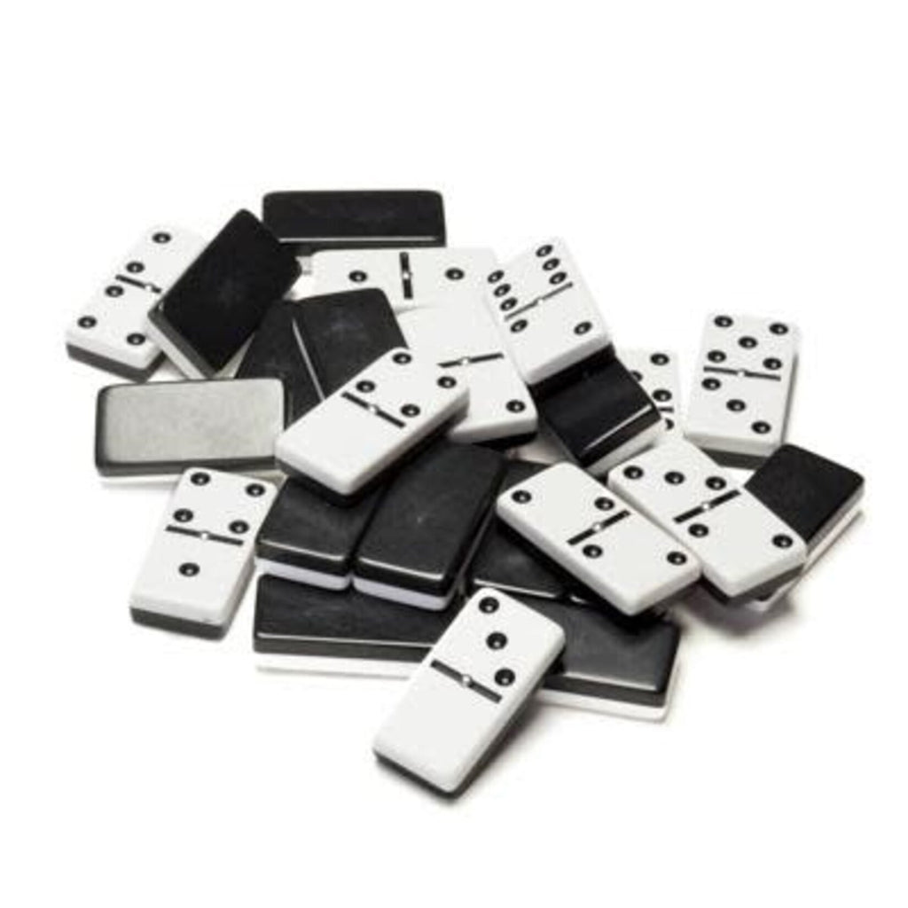 Pile of double-six black and white club size domino tiles scattered together